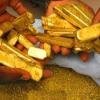 Venta de lingotes y polvo de oro.